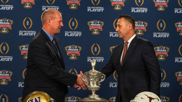 Washinton Huskies head coach Kalen DeBoer, left, meets Texas Longhorns head coach Steve Sarkisian, right, at the head coaches' press conference at the Sheraton hotel on Sunday, Dec. 31, 2023 in New Orleans, Louisiana. The Washington Huskies will take on the Texas longhorns in the College Football Playoff Semi-Finals on January 1, 2024.